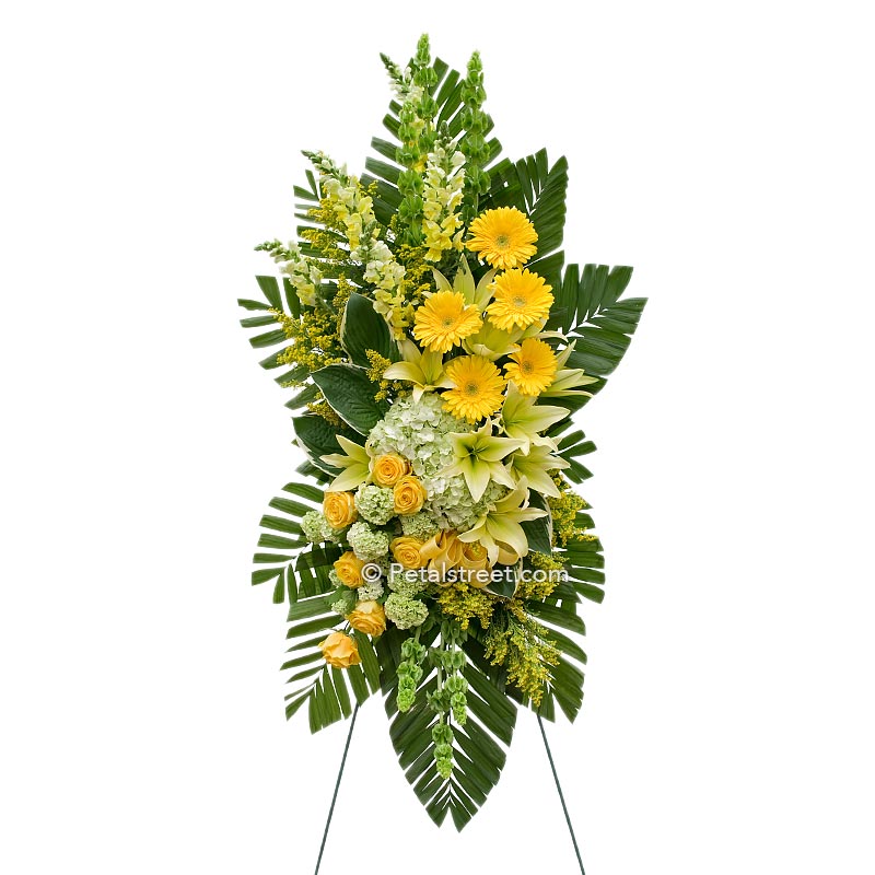 Large standing spray with yellow Lilies and Daisies, and green Hydrangea by Petal Street Flower Company florist.