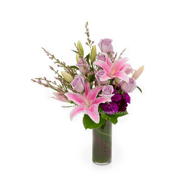 Beautiful anniversary flowers with pink and lavender Lilies and Roses by Petal Street Flower Co.