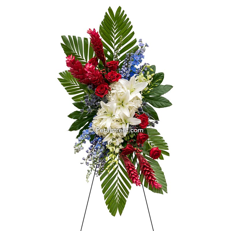 Red, white, blue funeral standing spray with Lilies, Roses, and Hydrangea by Petal Street Flower Company florist.