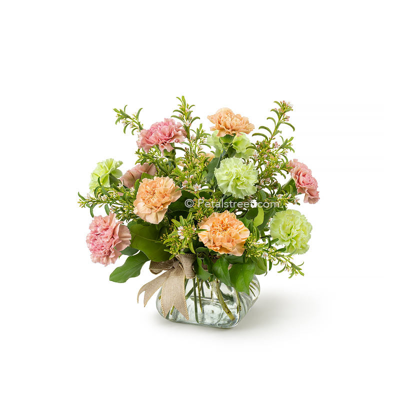 Mixed carnations in soft colors arranged in a vase with mini accent flowers and greenery by Petal Street Flower Company florist in Point Pleasant NJ