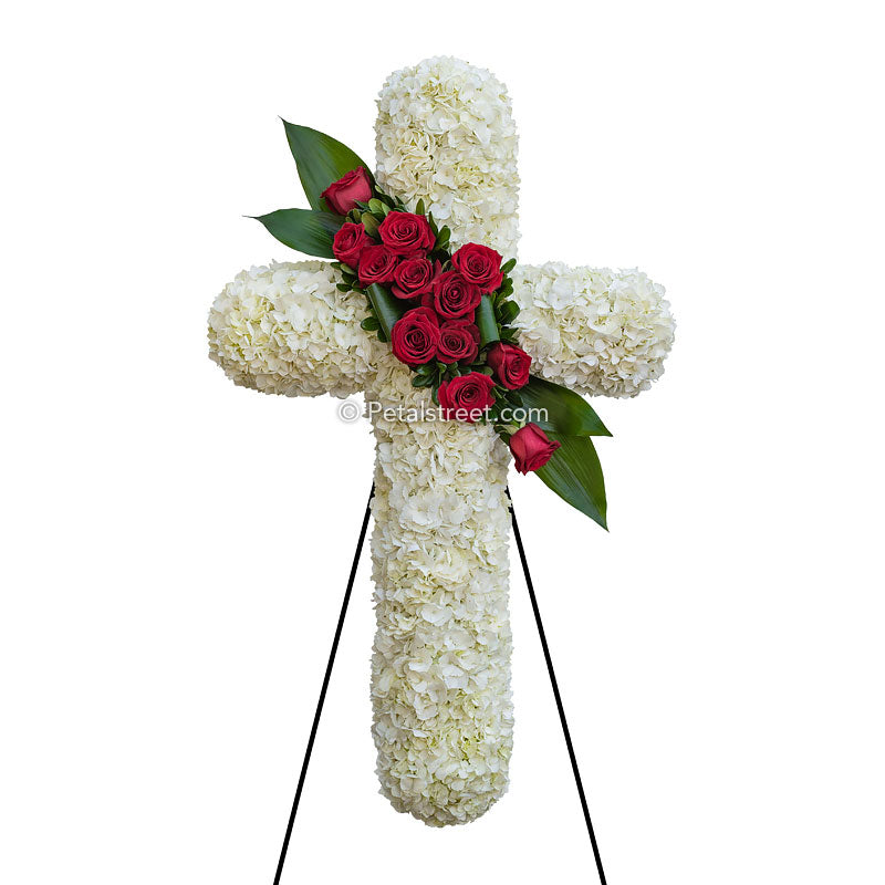 Funeral cross with red Roses and white Hydrangea.