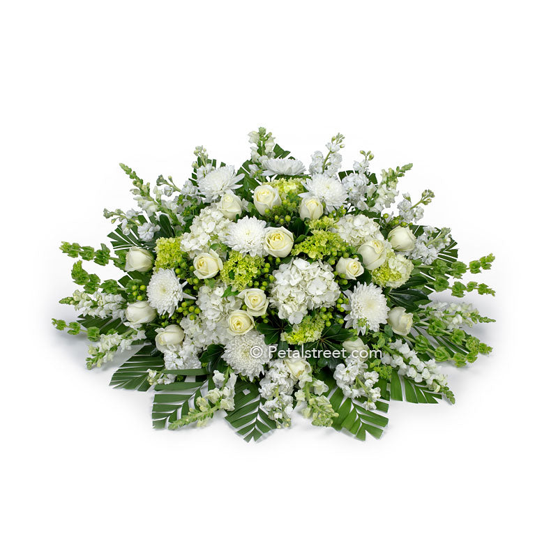 All white flower casket spray with Roses, Mums, and Daisies by Petal Street Flower Company.