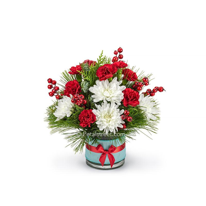 Vintage style Christmas flower arrangement with red, white, and robin egg blue colors this pieces has white Mums, red mini Carnations, mixed seasonal greens, and faux red Berries.