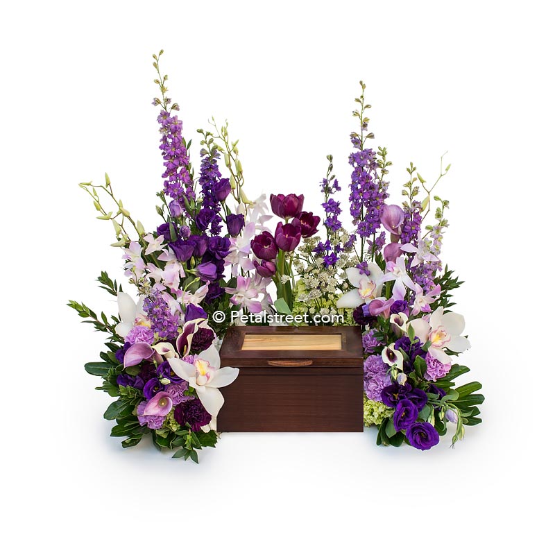 Floral Urn arrangement with white Orchids, lavender Calla Lilies, purple Lisianthus and Larkspur.