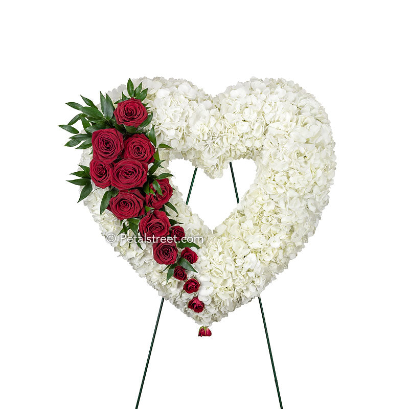 An elegant Funeral flower Bleeding Heart wreath with red Roses and white Hydrangea by Petal Street Flower Company florist in Point Pleasant, NJ.