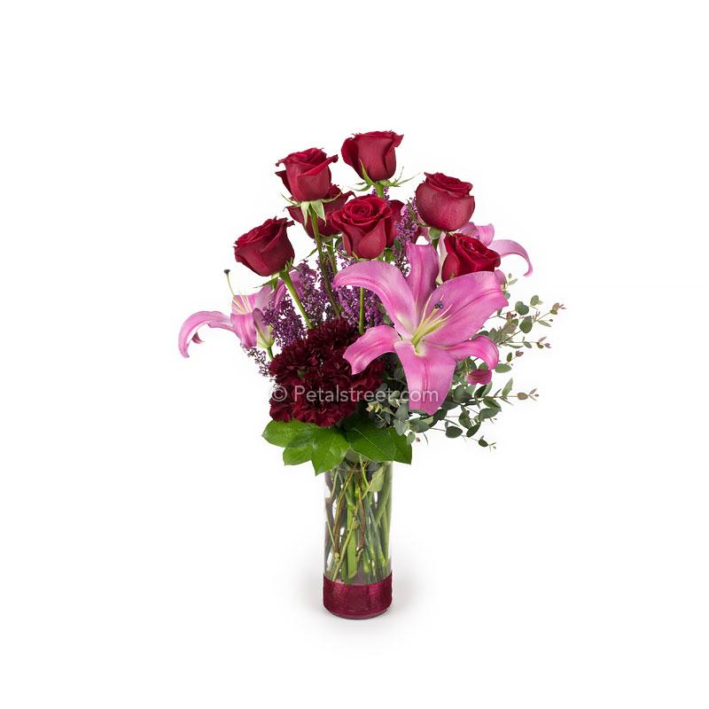 Valentine's Day Flowers with red Roses, pink Lilies, burgundy Carnations, pink Heather, and Eucalyptus accents.
