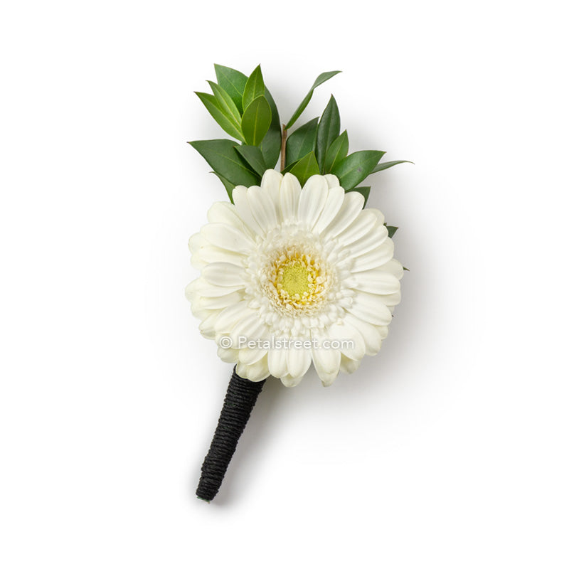 Mini white Gerbera Daisy boutonniere with green leaf accent and hand-tied black tuxedo twine finish on the stem
